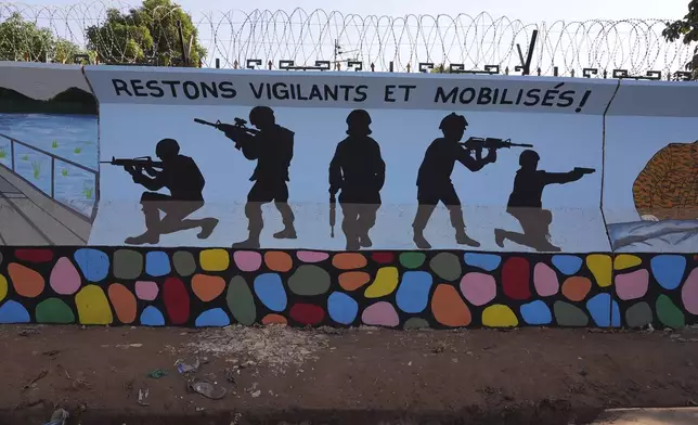 FILE - A mural reading "Stay vigilant and mobilized" is seen in Ouagadougou, Burkina Faso, March 1, 2023. (AP Photo, File)