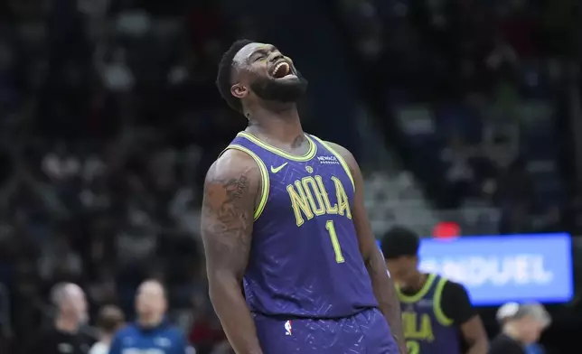 New Orleans Pelicans forward Zion Williamson (1) reacts after his slam dunk in the second half of an NBA basketball game against the Minnesota Timberwolves in New Orleans, Tuesday, Jan. 7, 2025. (AP Photo/Gerald Herbert)