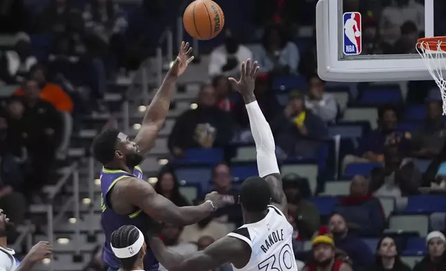 New Orleans Pelicans forward Zion Williamson shoots against Minnesota Timberwolves forward Julius Randle (30) in the first half of an NBA basketball game in New Orleans, Tuesday, Jan. 7, 2025. (AP Photo/Gerald Herbert)