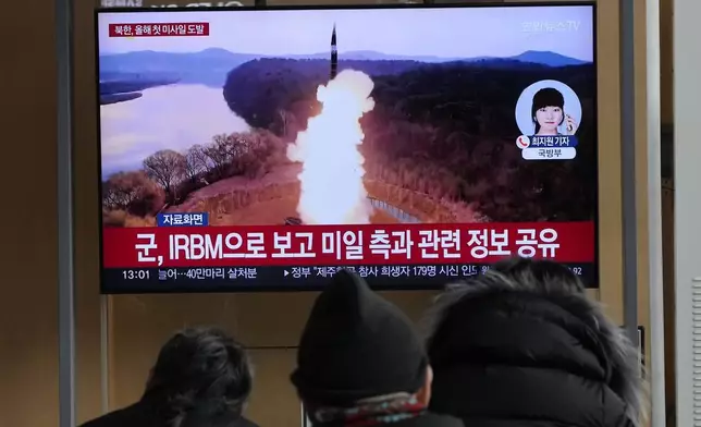 A TV screen shows a file image of North Korea's missile launch during a news program at Seoul Railway Station in Seoul, South Korea, Monday, Jan. 6, 2025. (AP Photo/Ahn Young-joon)