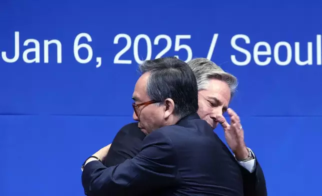 U.S. Secretary of State Antony Blinken, back, and South Korean Foreign Minister Cho Tae-yul, front, embrace each other after a joint press conference following their meeting at the Foreign Ministry in Seoul, South Korea, Monday, Jan. 6, 2025. (AP Photo/Lee Jin-man, Pool)