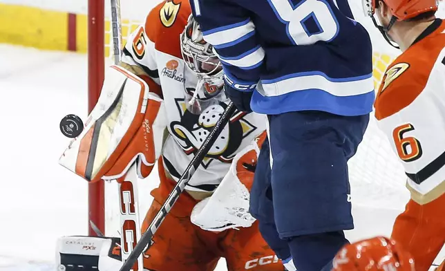 Anaheim Ducks goaltender John Gibson (36) stops the shot from Winnipeg Jets' Kyle Connor (81) during the second period of an NHL game in Winnipeg, Manitoba, Thursday, Jan. 2, 2025. (John Woods/The Canadian Press via AP)