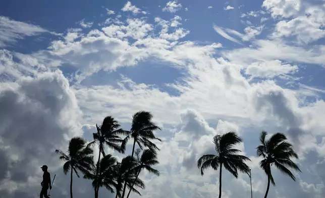 Eric Cole walks away from the 17th green during the first round of the Sony Open golf event, Thursday, Jan. 9, 2025, at Waialae Country Club in Honolulu. (AP Photo/Matt York)