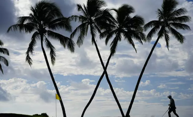 Taylor Pendrith, of Canada, walks across the 16th green during the first round of the Sony Open golf event, Thursday, Jan. 9, 2025, at Waialae Country Club in Honolulu. (AP Photo/Matt York)