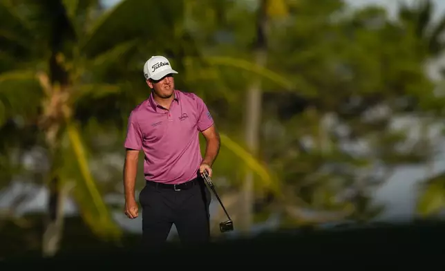 Tom Hoge watches his shot on the 17th green during the first round of the Sony Open golf event, Thursday, Jan. 9, 2025, at Waialae Country Club in Honolulu. (AP Photo/Matt York)