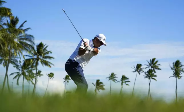 Hideki Matsuyama, of Japan, hits on the 11th hole during the first round of the Sony Open golf event, Thursday, Jan. 9, 2025, at Waialae Country Club in Honolulu. (AP Photo/Matt York)