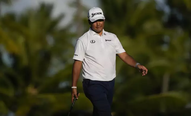 Hideki Matsuyama, of Japan, watches his shot on the 17th green during the first round of the Sony Open golf event, Thursday, Jan. 9, 2025, at Waialae Country Club in Honolulu. (AP Photo/Matt York)