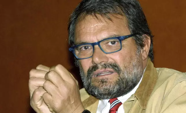 FILE - Italian photographer Oliviero Toscani attends a press conference on tobacco advertising in Geneva, Switzerland, Thursday, March 21, 2002. (AP Photo/ Donald Stampfli, File)