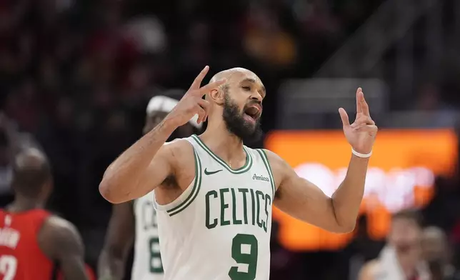 Boston Celtics' Derrick White (9) celebrates after making a 3-pointer against the Houston Rockets during the second half of an NBA basketball game Friday, Jan. 3, 2025, in Houston. The Celtics won 109-86. (AP Photo/David J. Phillip)