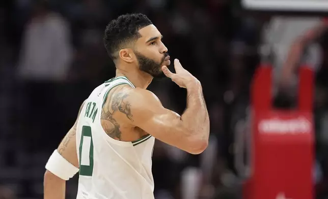 Boston Celtics' Jayson Tatum blows a kiss to the bench after making a 3-pointer against the Houston Rockets during the second half of an NBA basketball game Friday, Jan. 3, 2025, in Houston. (AP Photo/David J. Phillip)