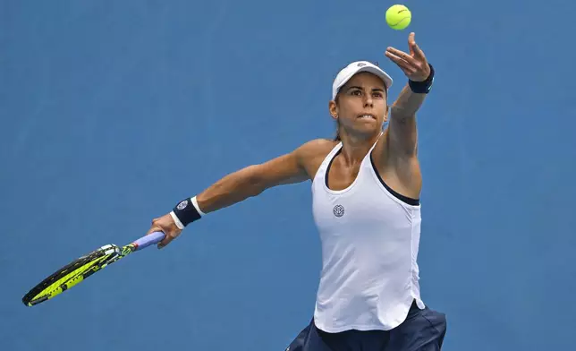 Julia Grabher of Austria serves to Naomi Osaka of Japan in their women's singles match of the ASB Classic tennis tournament at Manuka Doctor Arena in Auckland, New Zealand on Wednesday, Jan. 1, 2025. (Alan Lee/Photosport via AP)