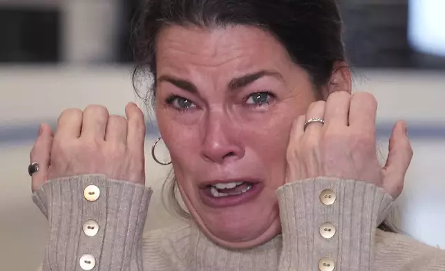 Former Olympic skater Nancy Kerrigan tries to hold back her emotions while addressing the media at The Skating Club of Boston, where six members of the club's community, including athletes, coaches and family, were killed in an airplane collision with a helicopter on Wednesday in Washington, Thursday, Jan. 30, 2025, in Norwood, Mass. (AP Photo/Charles Krupa)