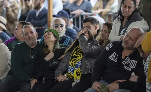 The family of Israeli soldier Sergeant Yahav Maayan who was killed in combat in the Gaza Strip, attends his funeral at a military cemetery in Modiin, Israel, Sunday, Jan. 12, 2025. (AP Photo/Ohad Zwigenberg)