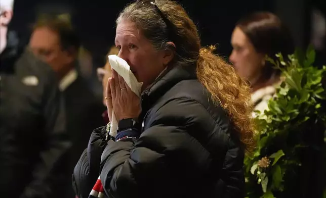 Mourners view the casket of former President Jimmy Carter as he lies in repose at the Carter Presidential Center in Atlanta, Saturday, Jan. 4, 2025. Carter died Dec. 29th at the age of 100. (AP Photo/Alex Brandon, Pool)