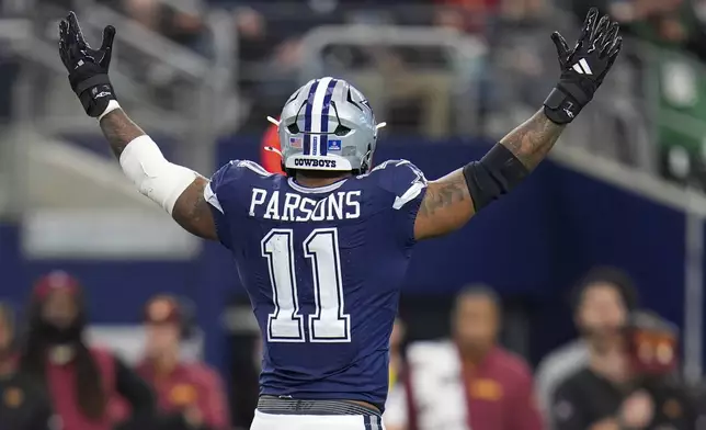 Dallas Cowboys linebacker Micah Parsons reacts after a sack against the Washington Commanders during the first half of an NFL football game, Sunday, Jan. 5, 2025, in Arlington, Texas. (AP Photo/Josh McSwain)