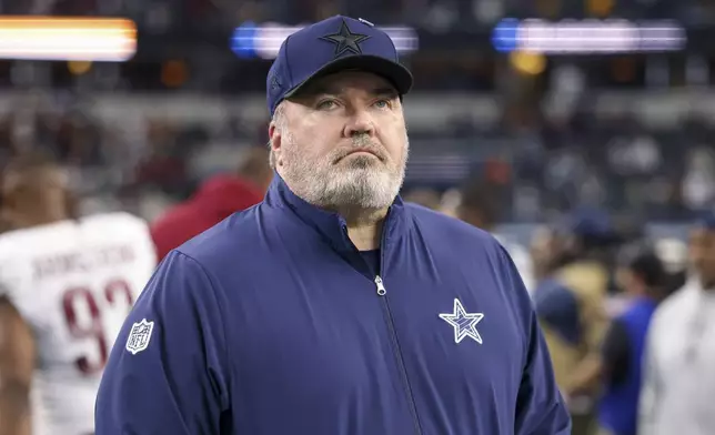 Dallas Cowboys head coach Mike McCarthy walks on the field following an NFL football game against the Washington Commanders, Sunday, Jan. 5, 2025, in Arlington, Texas. The Commanders won 23-19. (AP Photo/Gareth Patterson)