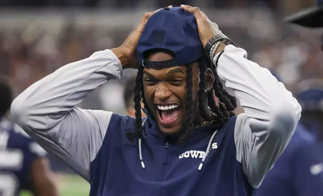 Dallas Cowboys wide receiver CeeDee Lamb reacts on the sideline prior to an NFL football game against the Washington Commanders, Sunday, Jan. 5, 2025, in Arlington, Texas. (AP Photo/Gareth Patterson)