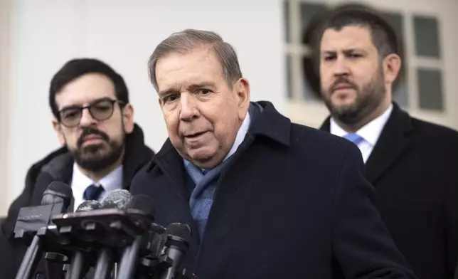 Venezuela's opposition leader Edmundo Gonzalez, center, speaks with reporters at the White House, Monday, Jan. 6, 2025, in Washington. (AP Photo/Mark Schiefelbein)