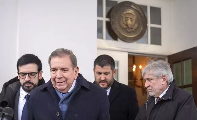 Venezuela's opposition leader Edmundo Gonzalez, second from left, speaks with reporters at the White House, Monday, Jan. 6, 2025, in Washington. (AP Photo/Mark Schiefelbein)