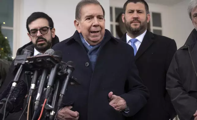 Venezuela's opposition leader Edmundo Gonzalez, center, speaks with reporters at the White House, Monday, Jan. 6, 2025, in Washington. (AP Photo/Mark Schiefelbein)