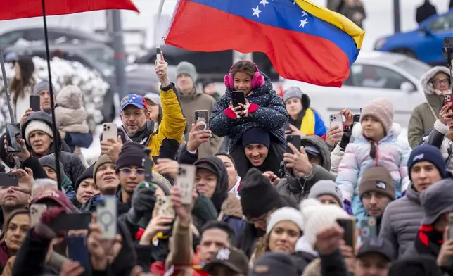 Supporters of Venezuelan opposition leader Edmundo Gonzalez react as he speaks to the group outside of the Organization of American States, Monday, Jan. 6, 2025, in Washington. (AP Photo/Jacquelyn Martin)