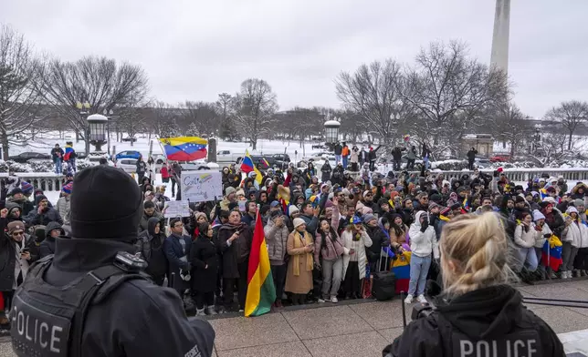 Supporters of Venezuelan opposition leader Edmundo Gonzalez gather outside of the Organization of American States, Monday, Jan. 6, 2025, in Washington. (AP Photo/Jacquelyn Martin)