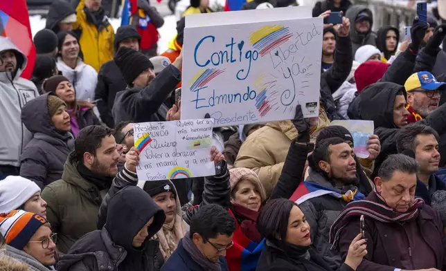 Supporters of Venezuelan opposition leader Edmundo Gonzalez hold signs calling him "President," outside of the Organization of American States, Monday, Jan. 6, 2025, in Washington. (AP Photo/Jacquelyn Martin)