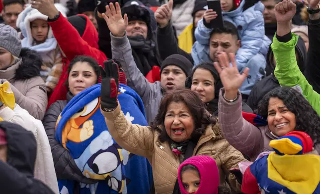 Petra Gambor, center, with her daughter Carolina di Martino Popovich, at right, reacts to a greeting by Venezuelan opposition leader Edmundo Gonzalez, outside of the Organization of American States, Monday, Jan. 6, 2025, in Washington. "We drove 10 hours in the snowstorm from Boston and we made it," said di Martino Popovich, "that is how much he means to us. We couldn't vote in Venezuela but we are here to recognize him as our president." The mother and daughter are long-time immigrants from Venezuela who live in Boston. (AP Photo/Jacquelyn Martin)