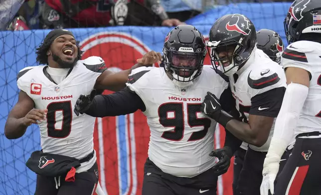 Houston Texans defensive end Derek Barnett (95) celebrates with teammates after returning a fumble for a touchdown against the Tennessee Titans during the second half of an NFL football game Sunday, Jan. 5, 2025, in Nashville, Tenn. (AP Photo/George Walker IV)