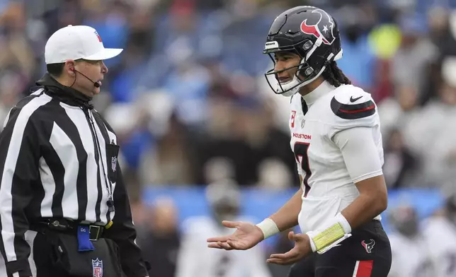 Houston Texans quarterback C.J. Stroud talks to an official during the first half of an NFL football game against the Tennessee Titans Sunday, Jan. 5, 2025, in Nashville, Tenn. (AP Photo/George Walker IV)