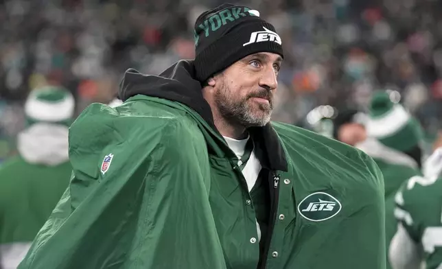 New York Jets quarterback Aaron Rodgers warms up following his 500th career regular-season touchdown pass during the first half of an NFL football game against the Miami Dolphins, Sunday, Jan. 5, 2025, in East Rutherford, N.J. (AP Photo/Seth Wenig)