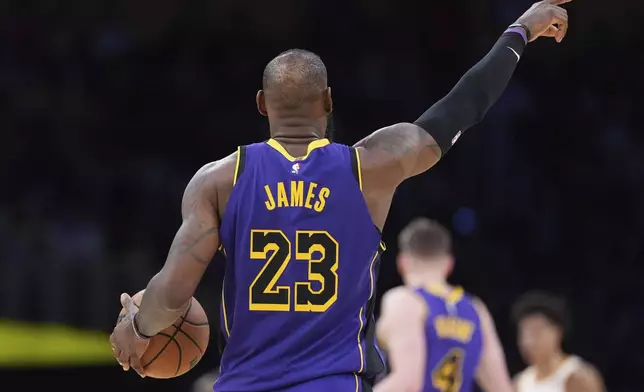 Los Angeles Lakers forward LeBron James gestures during the second half of an NBA basketball game against the Atlanta Hawks, Friday, Jan. 3, 2025, in Los Angeles. (AP Photo/Mark J. Terrill)