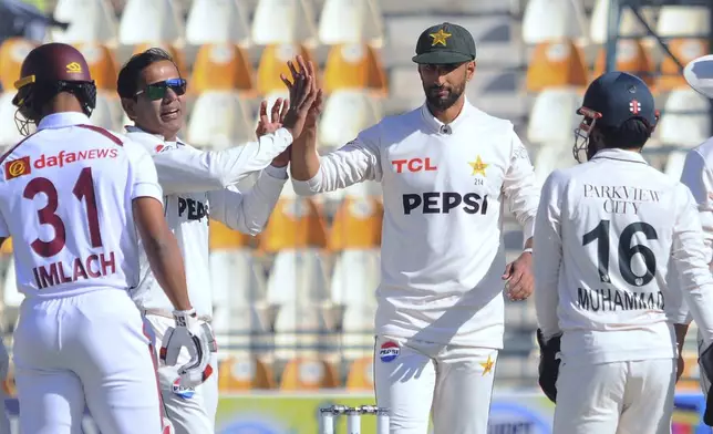 Pakistan's Noman Ali, second left, celebrates with teammates after taking the wicket of West Indies Justin Greaves during the day-one of the second cricket test match between Pakistan and West Indies, in Multan, Pakistan, Saturday, Jan. 25, 2025. (AP Photo/Asim Tanveer)