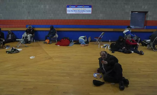 Patrons shelter from the cold inside a recreation center, Monday, Jan. 6, 2025, in Cincinnati. (AP Photo/Joshua A. Bickel)