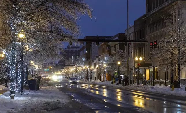 Vehicles drive along Main Street in Lexington, Ky., on Monday, Jan. 6, 2025. (Ryan C. Hermens/Lexington Herald-Leader via AP)