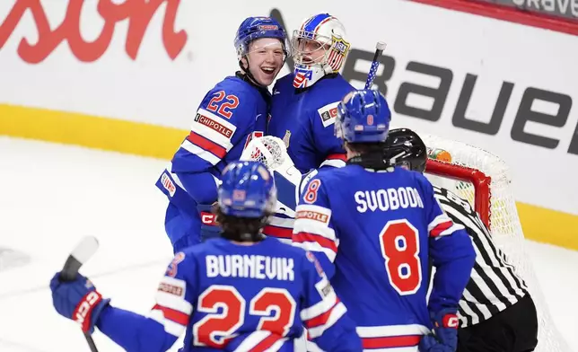 United States forward Max Plante (22) celebrates with teammate Trey Augustine (1) after they defeated Czechia in World Junior hockey championship semifinal game action in Ottawa, Ontario, Saturday, Jan. 4, 2025. (Sean Kilpatrick/The Canadian Press via AP)