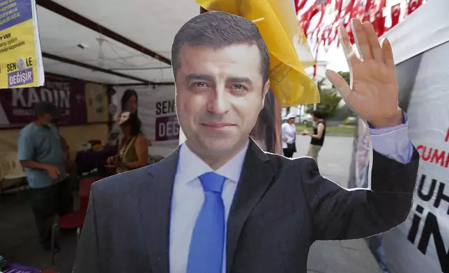 FILE - A cardboard cut-out of Selahattin Demirtas is pictured at an election kiosk in Istanbul, June 20, 2018. (AP Photo/Lefteris Pitarakis, File)