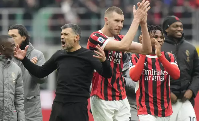 AC Milan's head coach Sergio Conceicao celebrates at the end of a Serie A soccer match between AC Milan and Parma, at the San Siro stadium in Milan, Italy, Sunday, Jan. 26, 2025. (AP Photo/Luca Bruno)