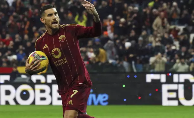 Roma's Lorenzo Pellegrini celebrates after scoring their side's first goal of the game during the Serie A soccer match between Udinese and Roma at the Bluenergy Stadium in Udine, Italy, Sunday, Jan. 26, 2025. (Andrea Bressanutti/LaPresse via AP)