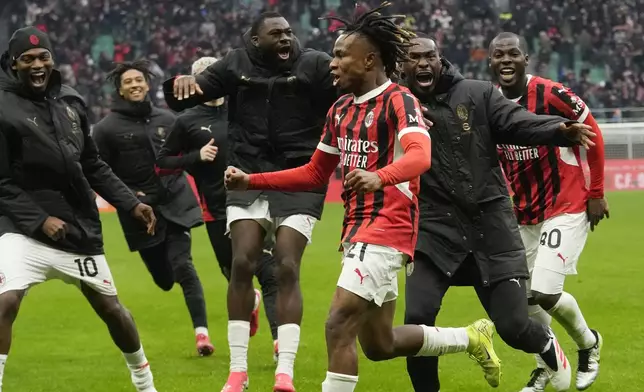AC Milan's Samuel Chukwueze celebrates after scoring his side's third goal during a Serie A soccer match between AC Milan and Parma, at the San Siro stadium in Milan, Italy, Sunday, Jan. 26, 2025. (AP Photo/Luca Bruno)
