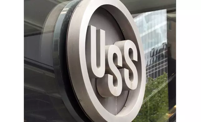 FILE - This April 26, 2010, file photo shows the United States Steel logo outside the headquarters building in downtown Pittsburgh. (AP Photo/Gene J. Puskar, File)