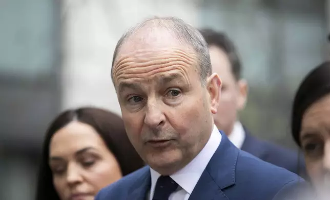 Fianna Fail leader Micheal Martin speaks to the media, in Dublin, Sunday Jan. 19, 2025. (Gareth Chaney/PA via AP)