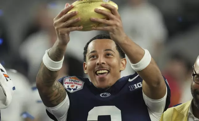 Penn State cornerback Jalen Kimber (3) celebrates after the Fiesta Bowl College Football Playoff game against Boise State, Tuesday, Dec. 31, 2024, in Glendale, Ariz. (AP Photo/Ross D. Franklin)