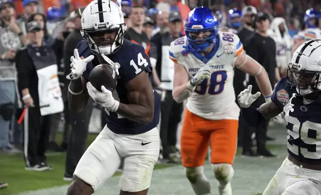 Penn State safety Tyrece Mills (14) intercepts a pass against Boise State during the second half of the Fiesta Bowl College Football Playoff game, Tuesday, Dec. 31, 2024, in Glendale, Ariz. (AP Photo/Rick Scuteri)