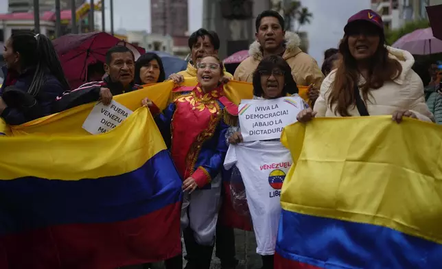 Opponents of Venezuelan President Nicolas Maduro participate in a protest the day before his inauguration for a third term, in La Paz, Bolivia, Thursday, Jan. 9, 2025. (AP Photo/Juan Karita)