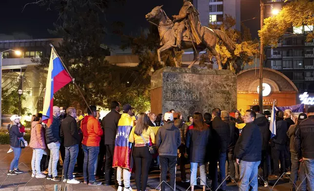 Opponents of Venezuelan President Nicolas Maduro protest the day before his inauguration for a third term, at Simón Bolivar Plaza in Guatemala City, Thursday, Jan. 9, 2025. (AP Photo/Moises Castillo)