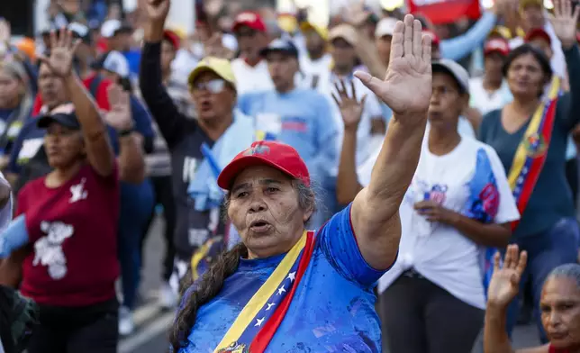 Government supporters listen to President Nicolas Maduro speaking on his inauguration day for a third term in Caracas, Venezuela, Friday, Jan. 10, 2025. (AP Photo/Cristian Hernandez)