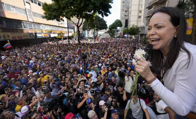 Opposition leader Maria Corina Machado addresses supporters during a protest against President Nicolas Maduro the day before his inauguration for a third term in Caracas, Venezuela, Thursday, Jan. 9, 2025. (AP Photo/Matias Delacroix)