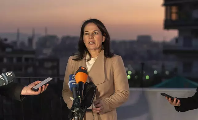 German Foreign Minister Annalena Baerbock holds a press conference during an official visit, in Damascus, Syria, Friday, Jan. 3, 2025. (AP Photo/Mosa'ab Elshamy)