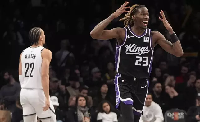 Sacramento Kings' Keon Ellis (23) celebrates after making a three-point shot during the second half of an NBA basketball game against the Brooklyn Nets Monday, Jan. 27, 2025, in New York. (AP Photo/Frank Franklin II)